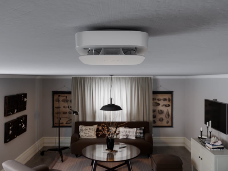 Détecteur Ajax FireProtect 2 installé au plafond d’une pièce de vie